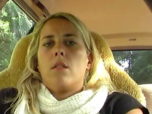 Blonde masturbating in the car in the parking lot