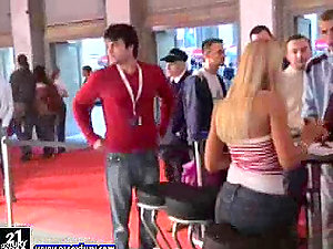 A few lovely damsels showcase their pole-dancing abilities in a public place
